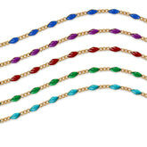 Gold filled chains with colorful enamel options on a white background